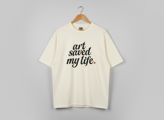 “Art Saved My Life” w/ Cara (Yellow) Art– T-Shirt (Tan/Cream)- Limited Edition